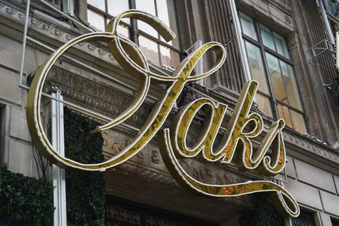 The company that owns the iconic luxury retailer Saks Fifth Avenue filed for bankruptcy late Tuesday.
The move comes after Saks Global struggled with debt it took on to buy rival Neiman Marcus, lagging department store sales and a rising online market.
It’s one of the largest retail collapses since the Covid pandemic, and casts further doubt over the future of luxury fashion.
The retailer, which also owns Bergdorf Goodman, said early Wednesday its stores would remain open for now after it finalized a $1.75 billion financing package and appointed a new CEO.
The court process is meant to give the luxury retailer room to negotiate a debt restructuring with creditors or sell itself to a new owner to stave off liquidation. Failing that, the company may be forced to shutter.
Former Neiman Marcus CEO Geoffroy van Raemdonck will replace Richard Baker, who was the architect of the acquisition strategy that left Saks Global saddled with debt.
The company also appointed former Neiman Marcus executives Darcy Penick and Lana Todorovich as chief commercial officer and chief of global brand partnerships at Saks Global, respectively.
Saks Fifth Avenue, the retail arm of Saks Global, listed $1 billion to $10 billion in assets and liabilities, according to court documents filed in U.S. Bankruptcy Court in Houston.
A retailer long loved by the rich and famous, from Gary Cooper to Grace Kelly, Saks fell on hard times after the pandemic, as competition from online outlets rose, and brands started more frequently selling items through their own stores.
The original Saks Fifth Avenue store, known for displaying the likes of Chanel, Cucinelli and Burberry, was opened by retail pioneer Andrew Saks in 1867.
The new financing deal would provide an immediate cash infusion of $1 billion through a loan from an investor group, Saks Global said.
A host of luxury brands were among the unsecured creditors, led by Chanel and Gucci owner Kering at about $136 million and $60 million respectively, the court filing said. The world’s biggest luxury conglomerate, LVMH, was listed as an unsecured creditor at $26 million. In total, Saks Global estimated there were between 10,001 and 25,000 creditors.
In 2024, Baker had masterminded the takeover of Neiman Marcus by Canada’s Hudson’s Bay Co, which had owned Saks since 2013, and later spun off the U.S. luxury assets to create Saks Global, bringing together three names that have defined American high fashion for more than a century.
The deal was designed to create a luxury powerhouse, but it saddled Saks Global with debt at a time when global luxury sales were slowing, complicating an already difficult turnaround for CEO and veteran executive Marc Metrick.
Saks Global struggled last year to pay vendors, who began withholding inventory, disrupting the company’s supply chain and leaving it with insufficient stock.
The thinly stocked shelves may have driven shoppers away to rivals like Bloomingdale’s, which posted strong sales in 2025, compounding pressure on Saks Global.
“Rich people are still buying,” Morningstar analyst David Swartz said last month, “just not so much at Saks.”
Running out of cash, Saks Global last month sold the real estate of the Neiman Marcus Beverly Hills flagship store for an undisclosed amount. It had also been looking to sell a minority stake in exclusive department store Bergdorf Goodman to help cut debt.
On Dec. 30, it failed to make an interest payment of more than $100 million to bondholders.
This post appeared first on NBC NEWS